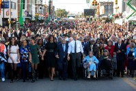 Barack Obama, Michelle Obama, joining hands with John Lewis, accompanied by Sacha, Malia Obama and Marian Robinson as they lead the walk.