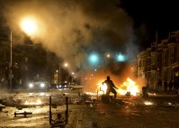 Street in fire after a riot.