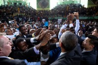 Barack Obama greeting audience members.