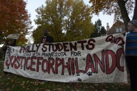 Protesters holding a banner with the writings "Philly Student Stand with Minnesota Justice for Philando"